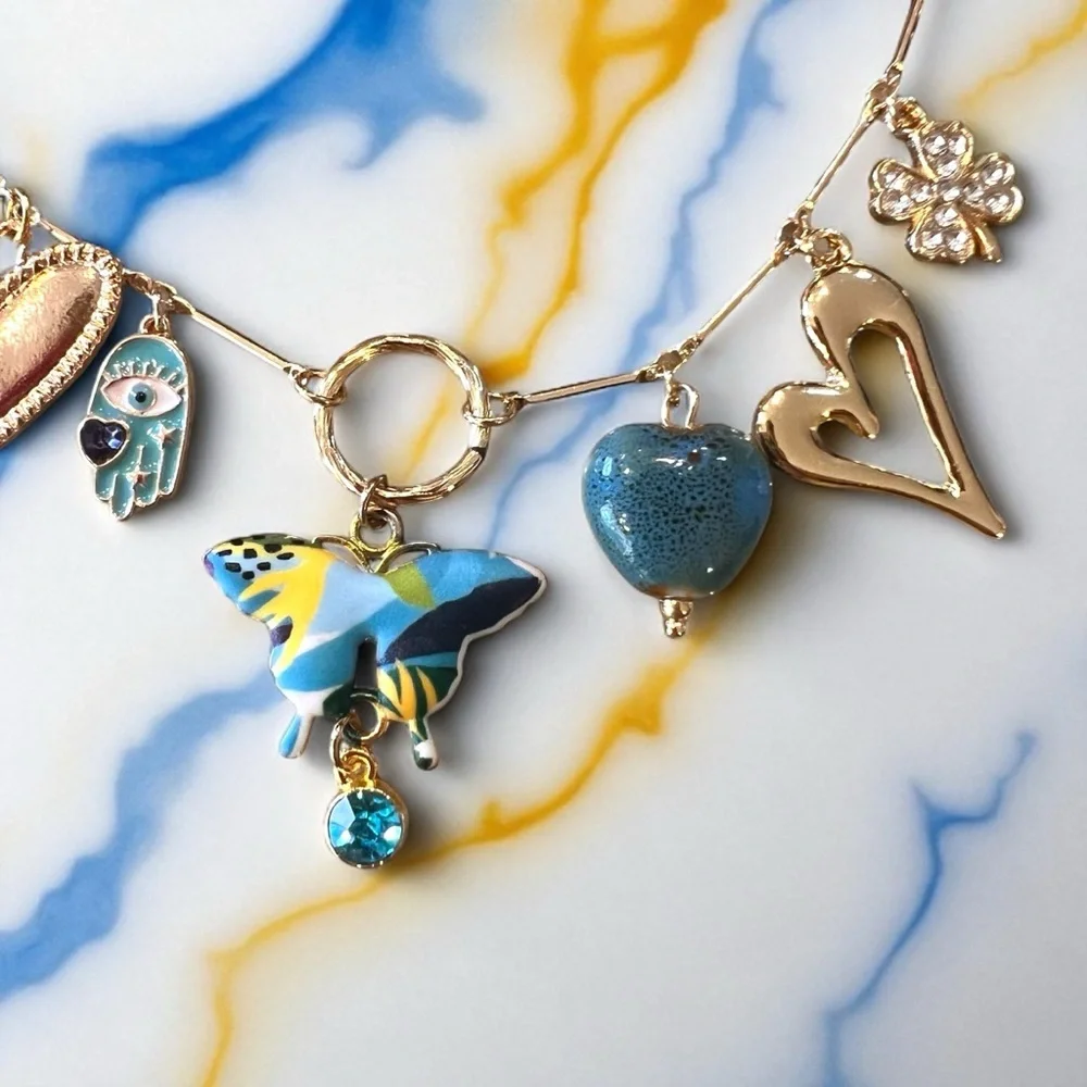 Unique and Gorgeous Gold toned Necklace with Varying Blue and Yellow Charms